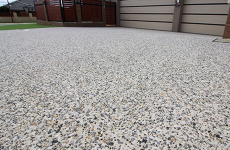 Exposed aggregate concrete finish showing natural stone texture in Canberra