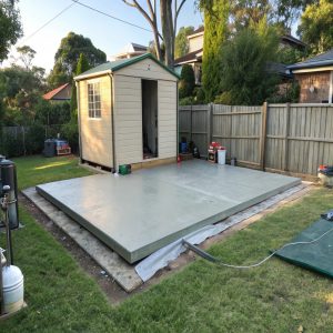 Concrete base prepared for a backyard shed
