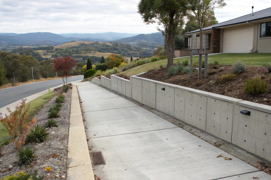 Freshly completed concrete retaining wall on a rural property