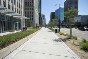 Wide commercial concrete footpath alongside a modern building